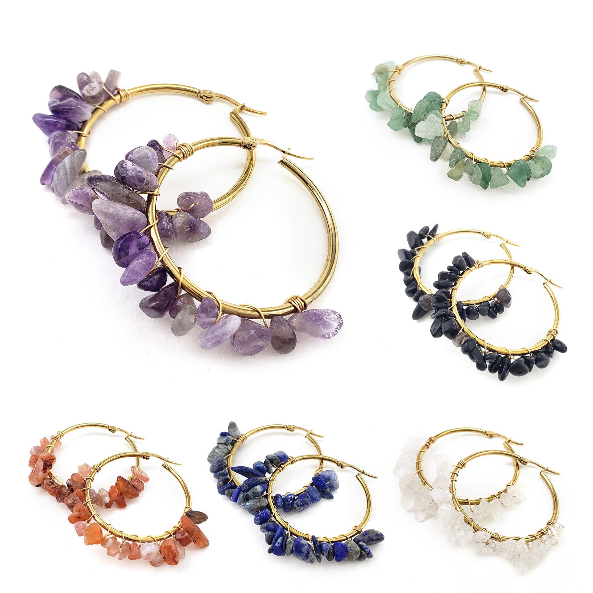 These earrings feature golden hoops paired with natural green stones, symbolizing the vitality and growth of nature. Green gemstones are often seen as symbols of balance and health, bringing a sense of inner peace, making them ideal for wearers looking to connect with nature's energy.